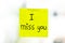 I miss you word on sticky note