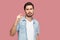 I need a few more. Portrait of hopeful handsome bearded young man in blue casual style shirt standing and looking at camera and