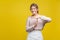 I need more time. Portrait of tired upset young woman with fair hair in casual beige blouse, isolated on yellow background