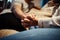 I never want to let go. a young couple holding hands while sitting together at home.