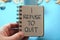 I refuse to quit, text words typography written on book against blue background, life and business motivational inspirational