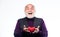 I am saved. bearded man has heart failure. happy mature man hold red heart. love and romance. valentines day. donor