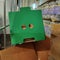 I see faces. Card board box in a warehouse. The holes in the box give the impression the cardboard container has a face.