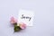 I am sorry message card with pink flowers