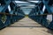 I-steel truss bridge with planked floor for pedestrians over riv