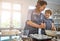 I think we should bake more often mom. a mother and her son baking something in the kitchen.