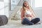 I want you to remember is that motherhood looks amazing on you. a pregnant woman touching her belly while sitting at