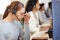 I wish I could hangup on this caller. a young call centre agent looking stressed out while working in an office with her