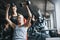 I wont stop until Im proud. a mature woman lifting weights with a female instructor at the gym.