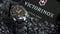Ibach, Switzerland 7.04.2020 - Victorinox Man watch stainless steel case lying on gray pebbles