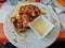 Iberian tenderloin steak with Torta del Casar sauce an fried potatoes .