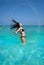 Ibiza beach girl water hair flip in Balearics