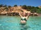 Ibiza bikini girl relaxed in clear water beach