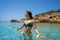 Ibiza bikini girl relaxed in clear water beach