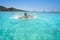 Ibiza bikini girl splashing clear water beach