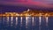 Ibiza Eivissa town sunset with city lights reflection in Mediterranean sea of balearic Islands