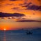 Ibiza sunset Es Vedra view and fisherboat formentera