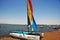 Ica Paracas Bay with its beaches and catamaran sailboat with colored sails in the Pacific Ocean of Peru