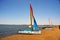 Ica Paracas Bay with its beaches and catamaran sailboat with colored sails in the Pacific Ocean of Peru