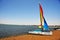 Ica Paracas Bay with its beaches and catamaran sailboat with colored sails in the Pacific Ocean of Peru