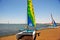 Ica Paracas Bay with its beaches and catamaran sailboat with colored sails in the Pacific Ocean of Peru