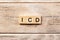 Icd word written on wood block. icd text on table, concept