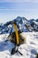 Ice axe, helmet and glasses glacier in the mountains.