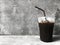 Ice Black Coffee on the cement Background