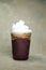 Ice Blended Chocolate served in disposable cup isolated on grey background side view of cafe dessert