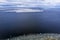 Ice blocks drifting around in a calm sea water creating interesting aerial patterns.