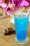 Ice blue soda on timber table