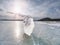 Ice breaking. Floe on frozen lake with sunset sky