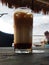 Ice brewed coffee at a beachside cafe while enjoying the sunset