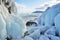 Ice build-up on the rocky shore of the island of Olkhon near meteorological station of Uzury. Lake Baikal, Russia