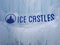 Ice castles sign at an icy winter attraction