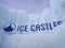 Ice castles sign at an icy winter attraction
