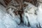 Ice cave, Icicles in the rocky caves, Lake Baikal in winter, Siberia