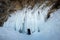 Ice cave, Icicles in the rocky caves, Lake Baikal in winter, Siberia