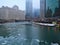 Ice chunks on a frozen Chicago River in January alongside snow covered riverwalk.