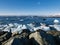 Ice chunks from the glacier drift in the sea