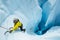Ice climber expertly ascending out of a massive mouin in the Matanuska Glacier