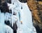 Ice climbing at frozen waterfall