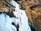 Ice climbing at frozen waterfall