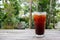 Ice coffee,americano,lemon tea,cola on wood table with green nature background. Copy space