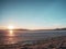 ICe cover lagoon. Winter landscape with frozen lake and sunset