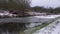 Ice covered canal in winter after snowfall landscape