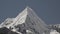 ice covered glacier of pyramid shaped mountain, laguna paron