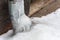 Ice-covered gutter in winter