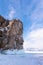 Ice-covered Ogoy Island in the Maloye More Bay of Lake Baikal in winter. Siberia, Russia