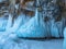 Ice-covered Ogoy Island in the Maloye More Strait of Baikal in winter. Siberia, Russia